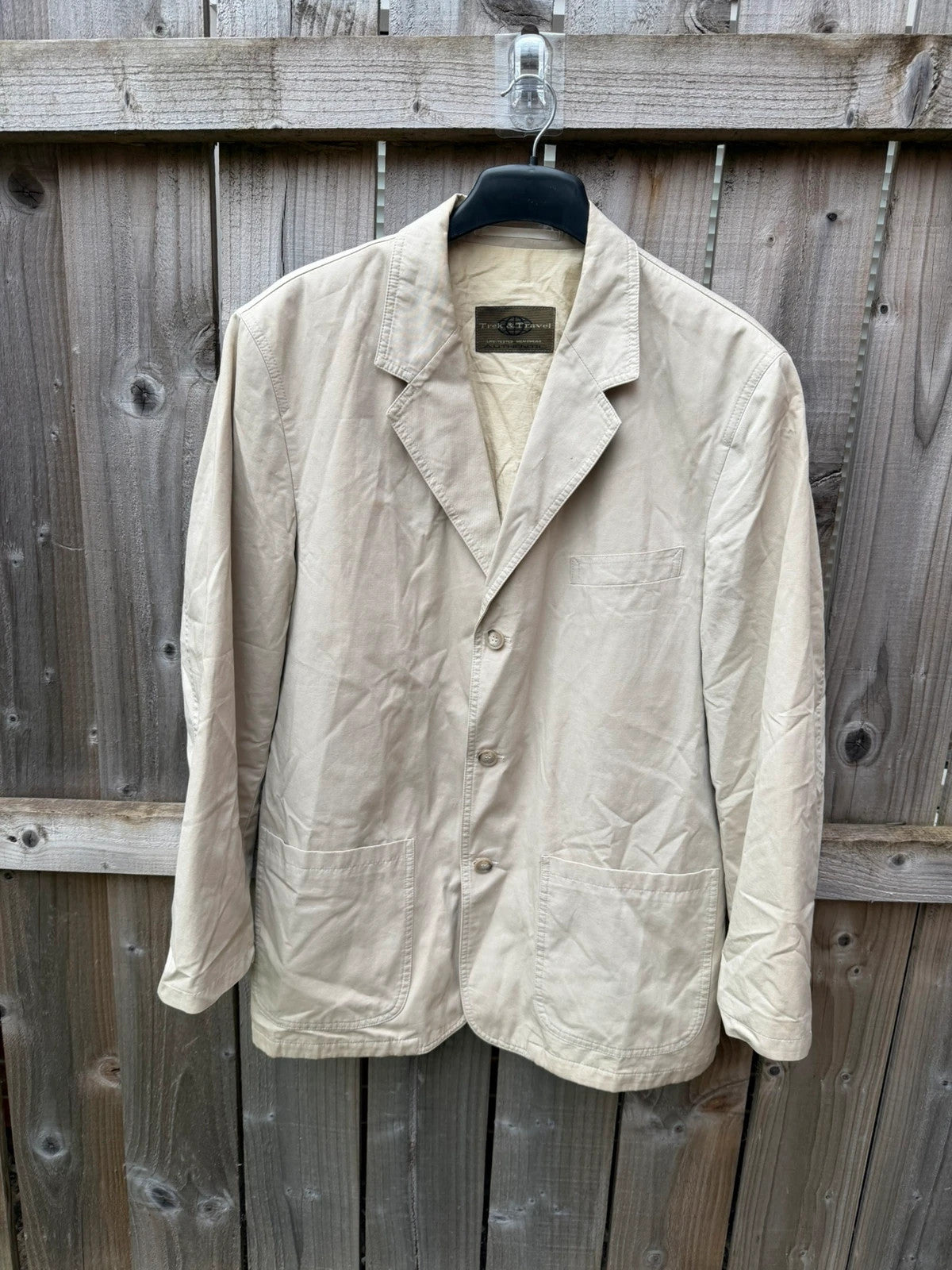 TREK cream lightweight utility blazer jacket with multiple pockets and casual safari style.
