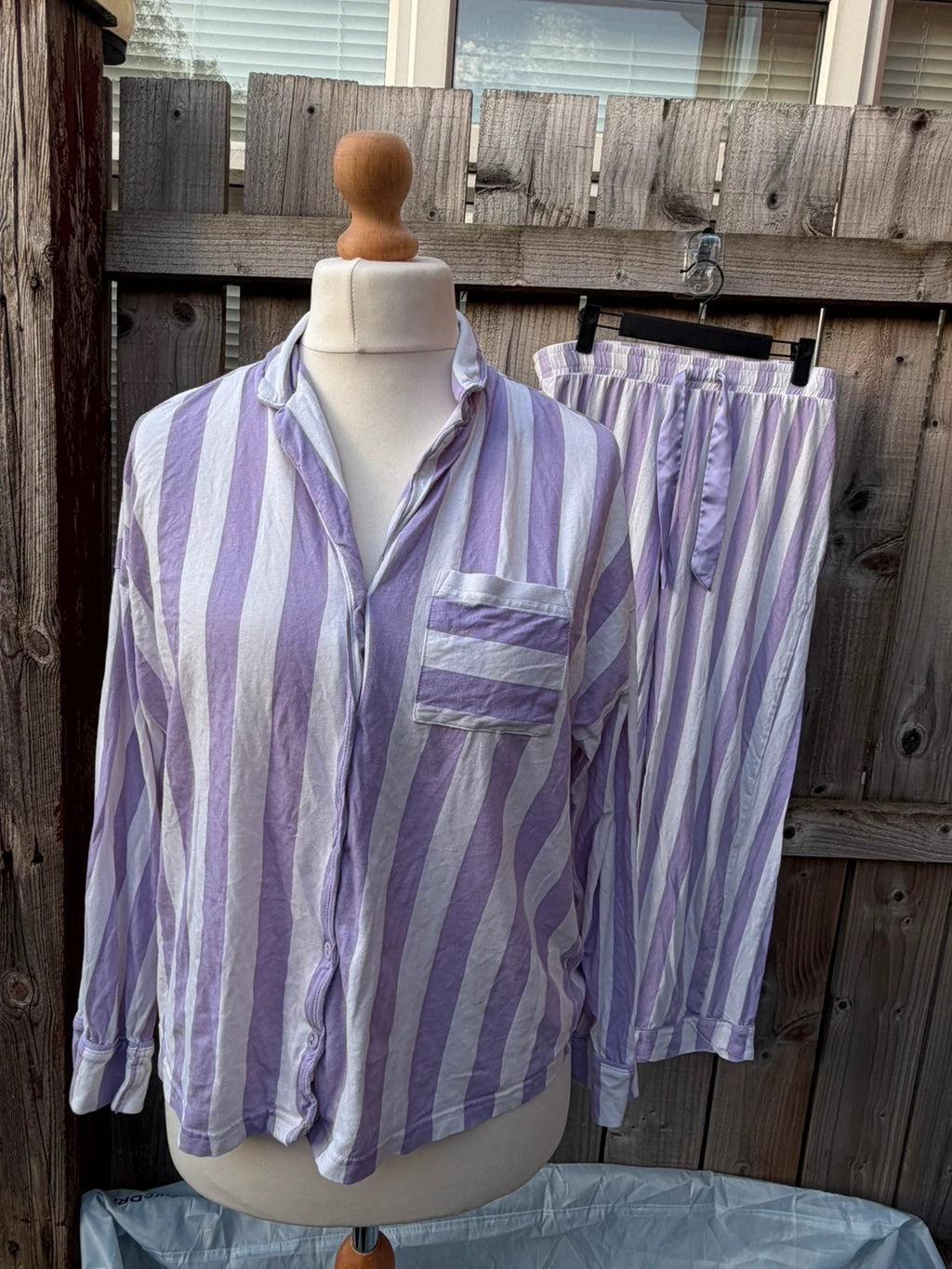 George lilac and white striped pyjama set with button-up shirt and wide leg trousers.