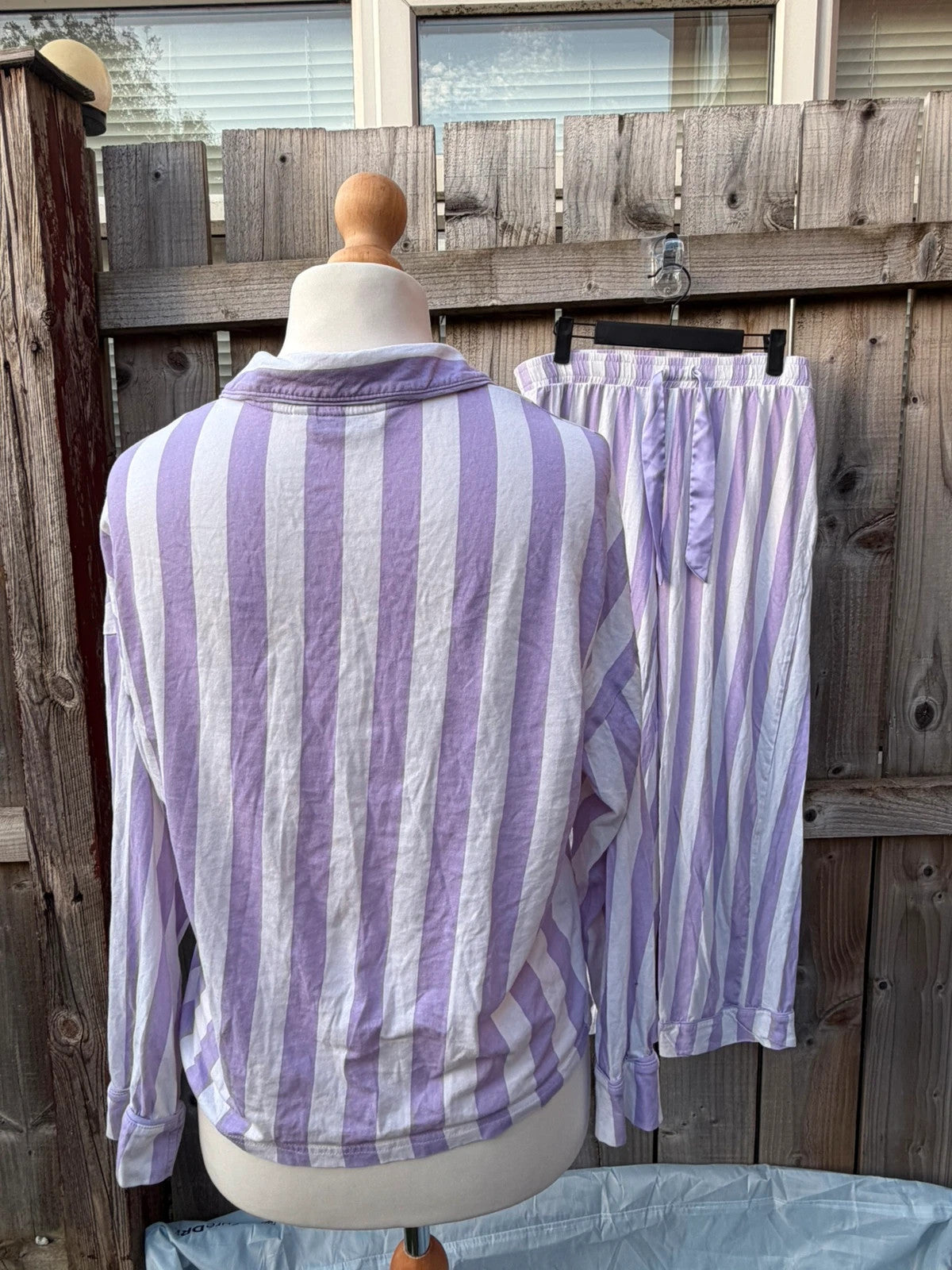 George lilac and white striped pyjama set with button-up shirt and wide leg trousers.