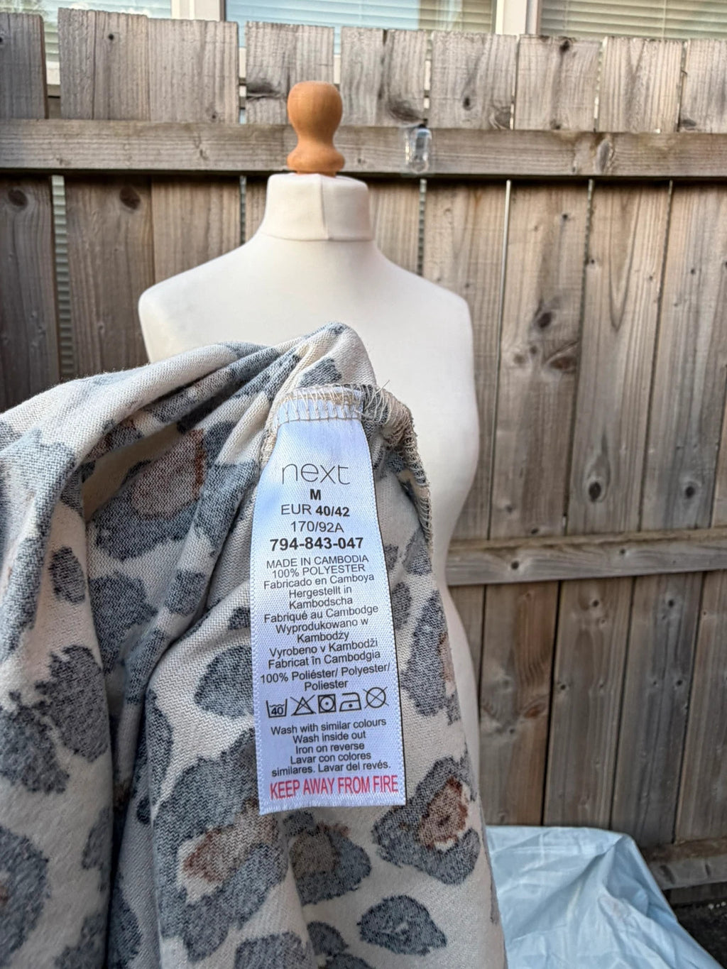 Next beige and brown leopard print oversized tunic blouse with button details.