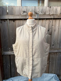 BHS beige padded puffer gilet sleeveless jacket with minimalist design and neutral tones.