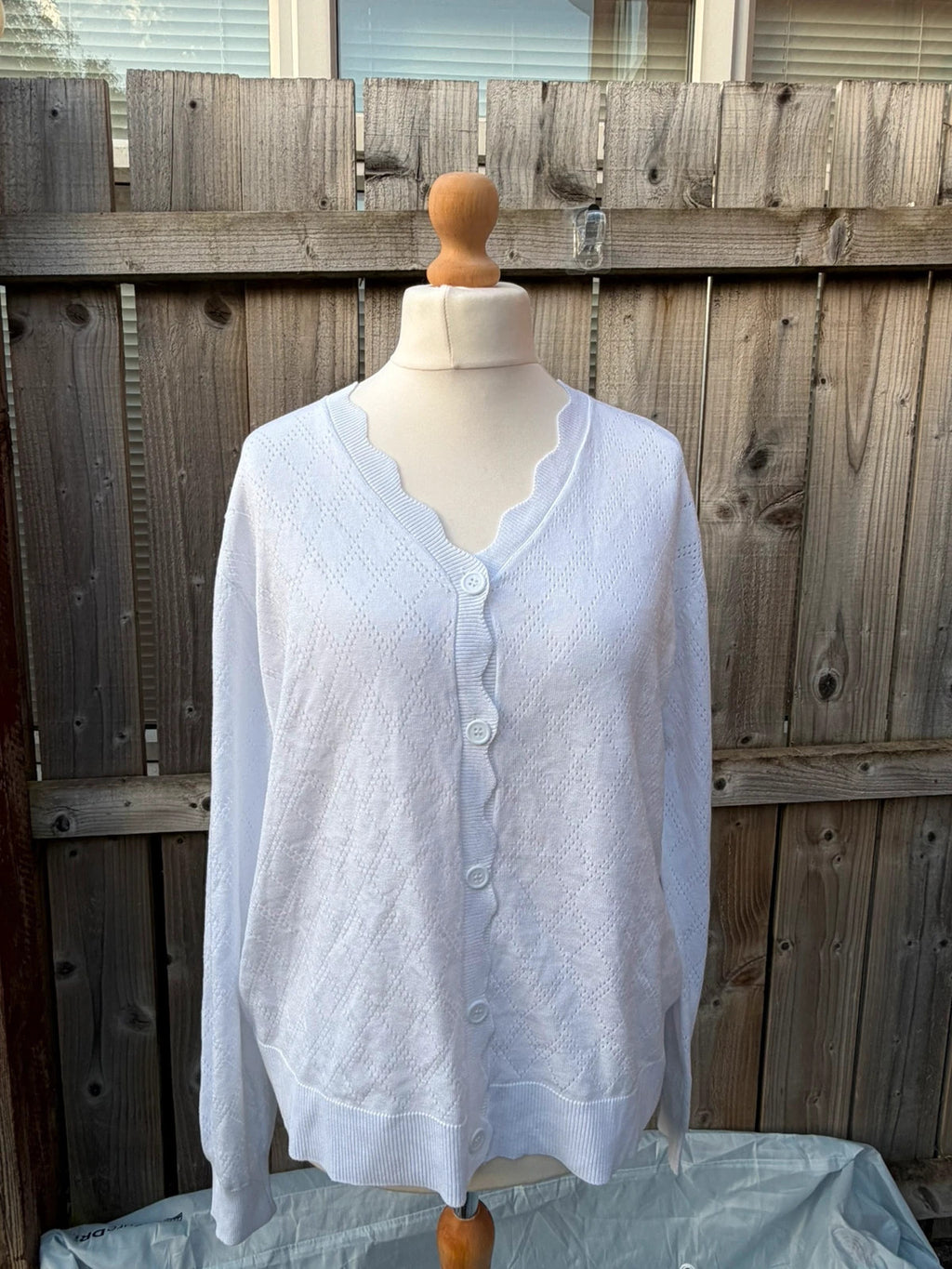 Whites white knit cardigan with scallop edge and button-up front, soft material.