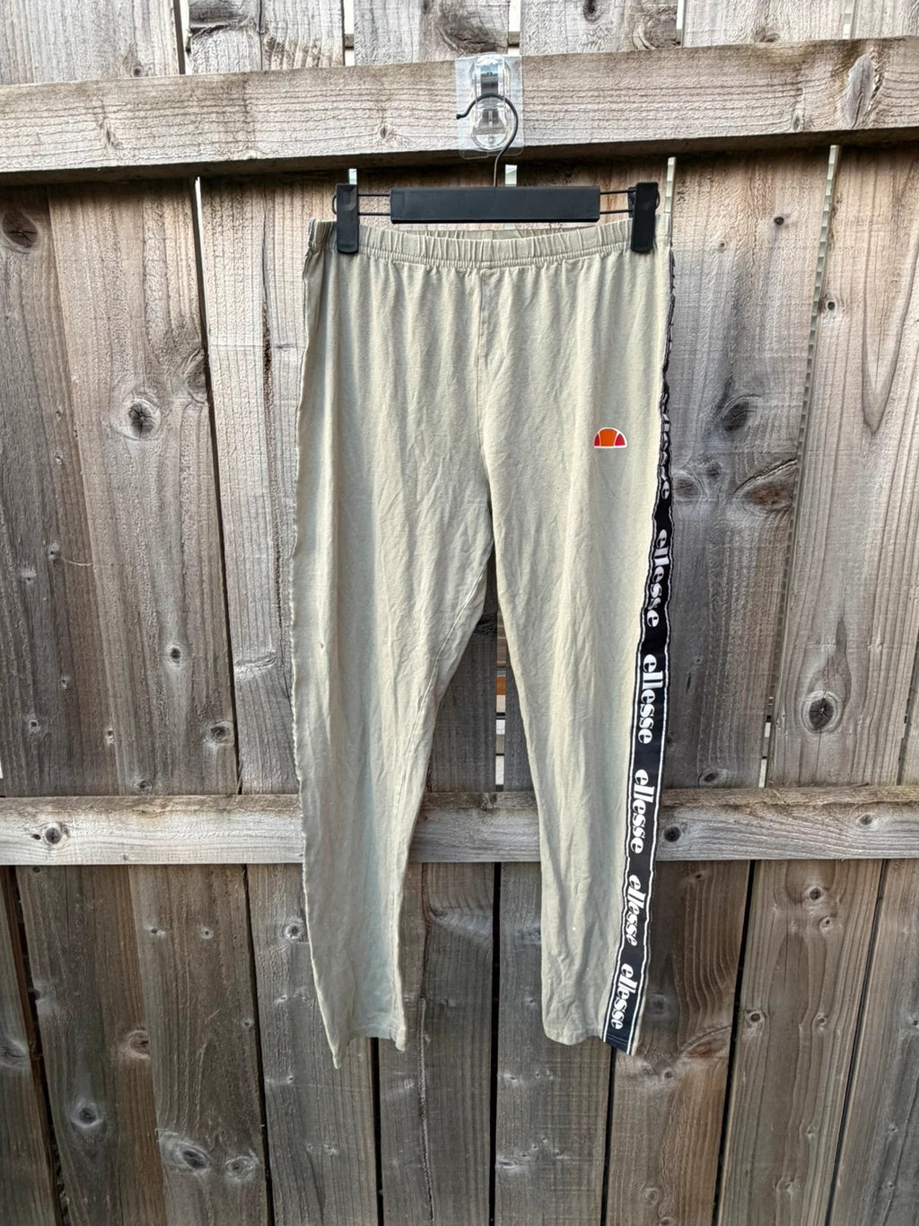 Ellesse khaki leggings with logo side stripe, stretchy material, pre-loved condition.