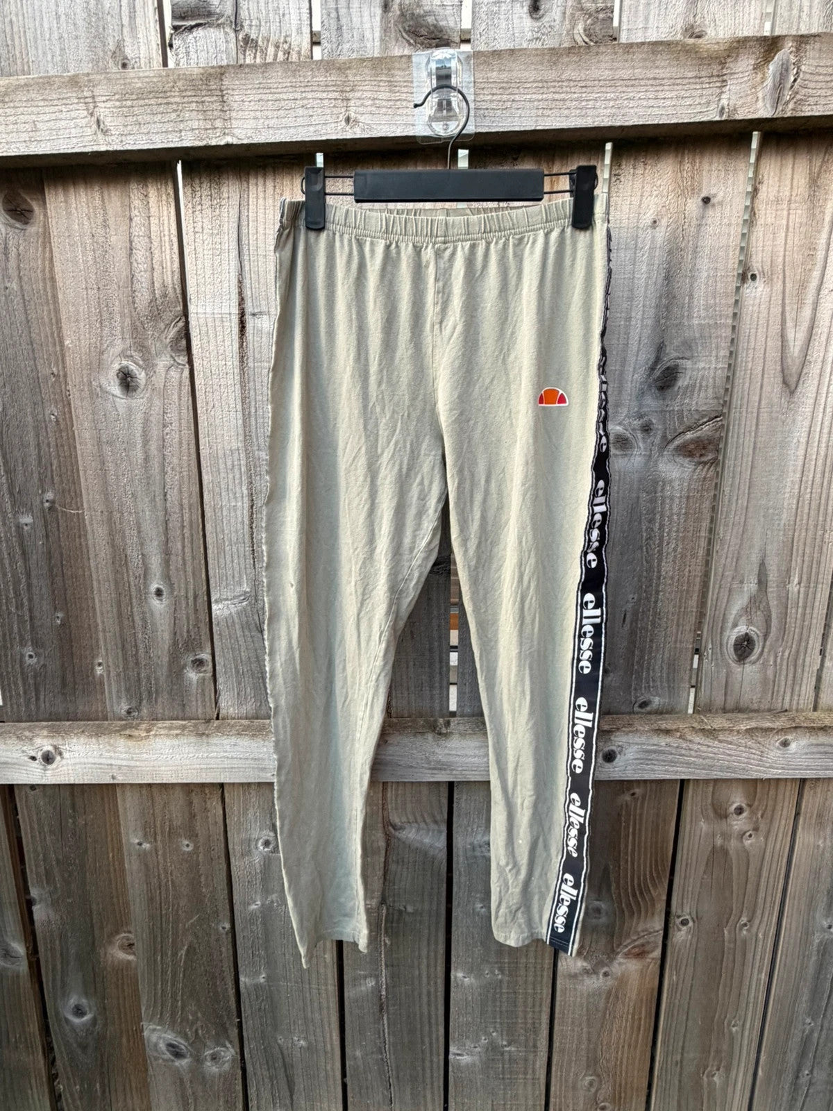 Ellesse khaki leggings with logo side stripe, stretchy material, pre-loved condition.