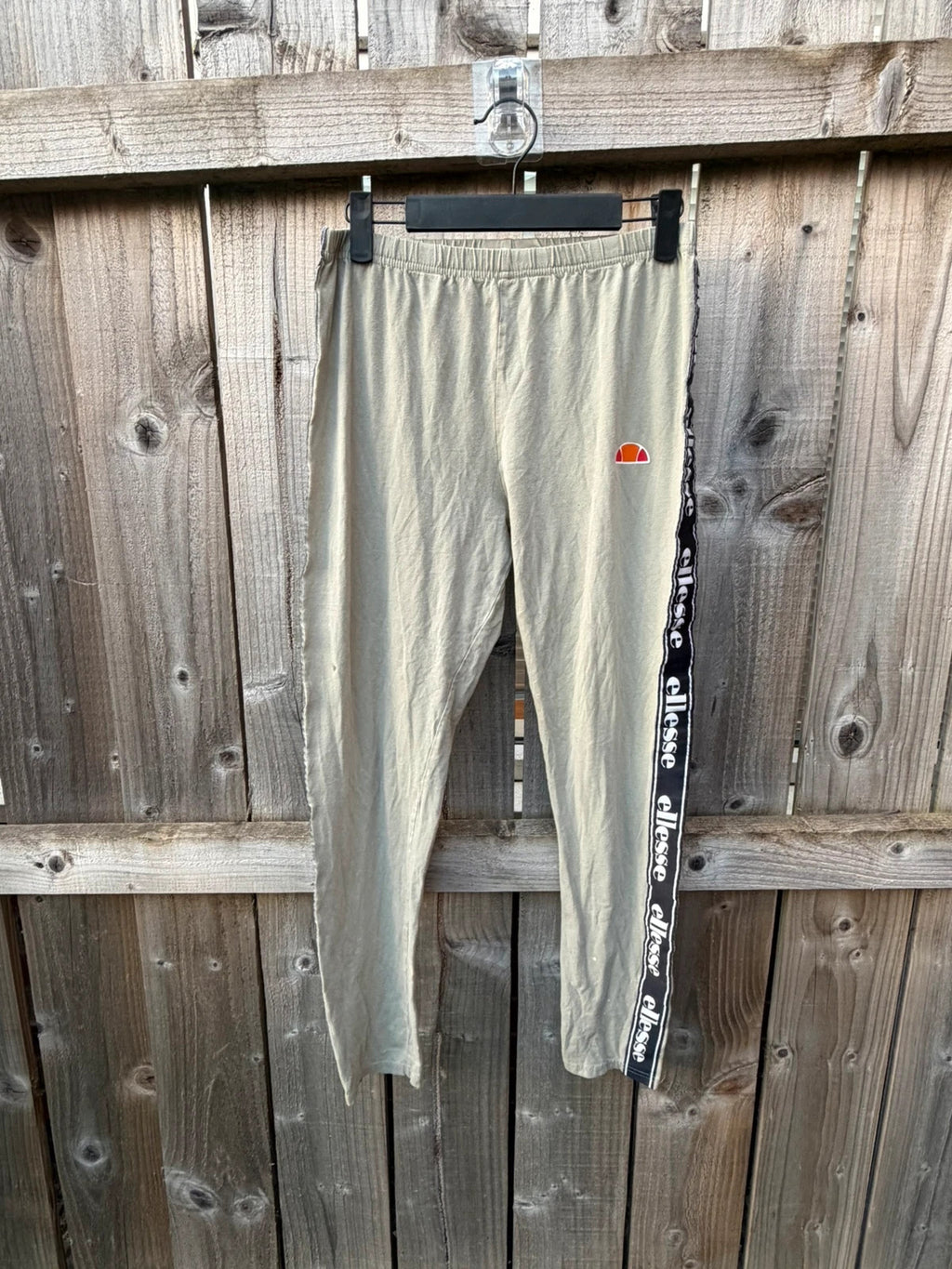 Ellesse khaki leggings with logo side stripe, stretchy material, pre-loved condition.