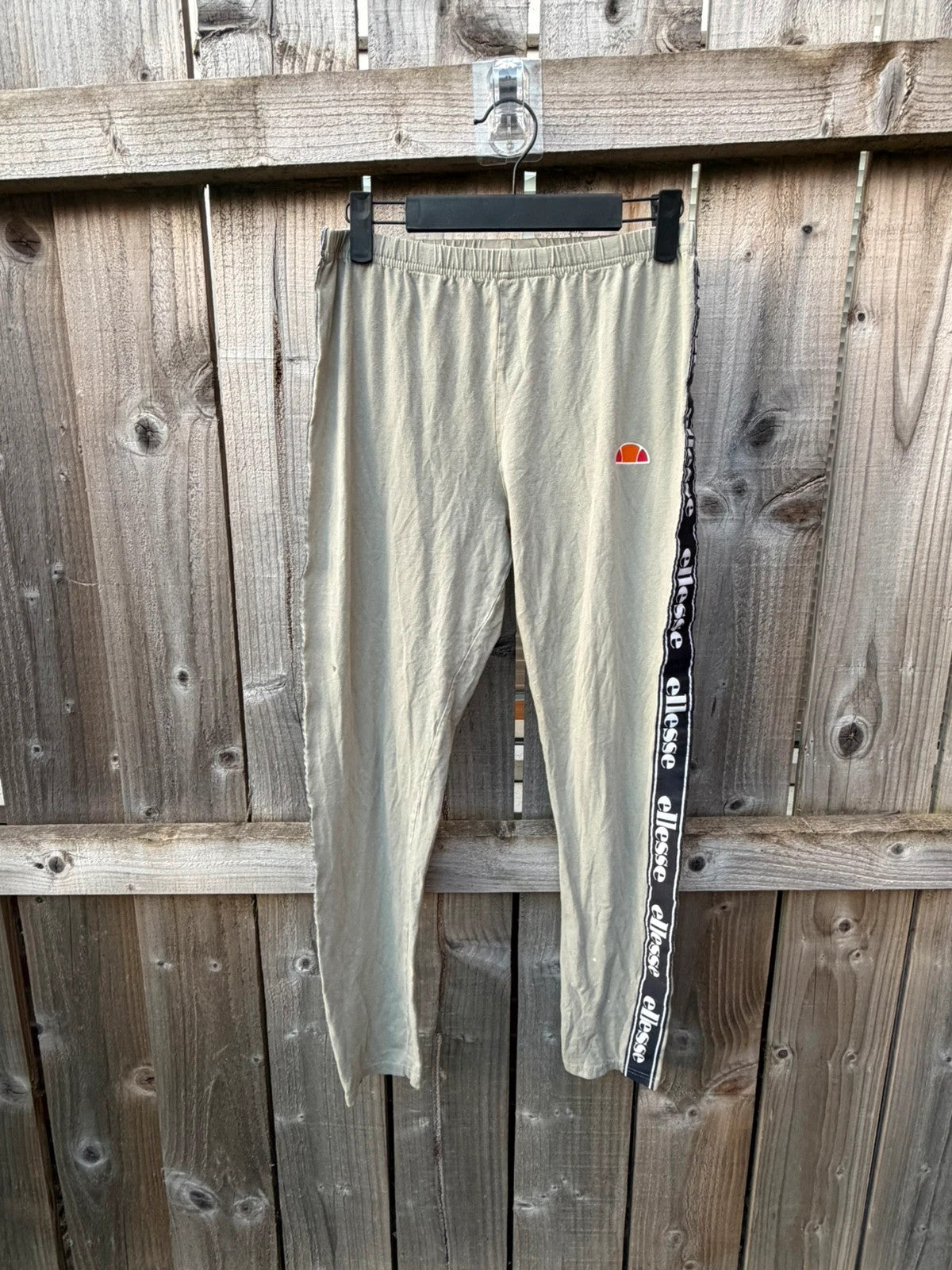 Ellesse khaki leggings with logo side stripe, stretchy material, pre-loved condition.