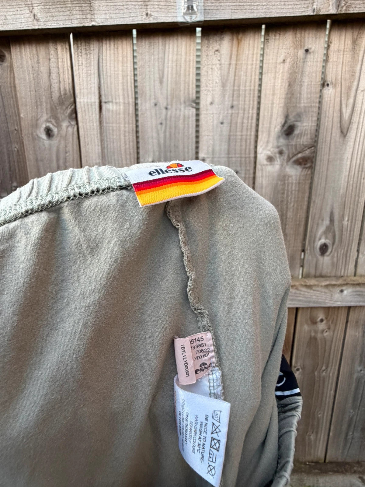 Ellesse khaki leggings with logo side stripe, stretchy material, pre-loved condition.