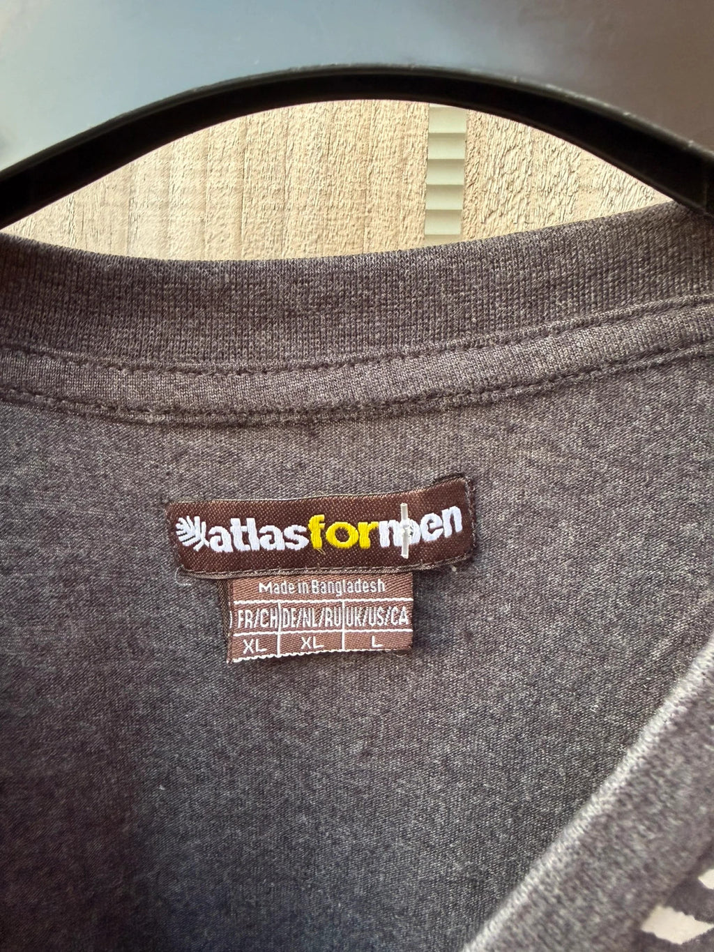 Atlas for Men blue and grey graphic t-shirt with athletic design and logo.