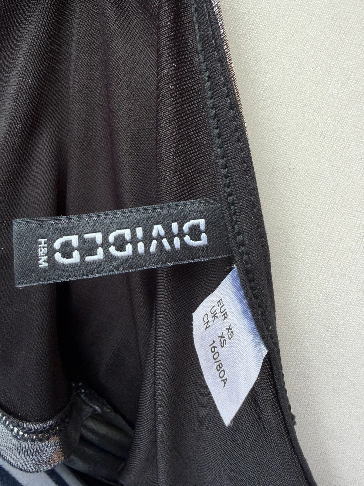 H&M Divided black and silver strappy crop cami top with shimmering details.