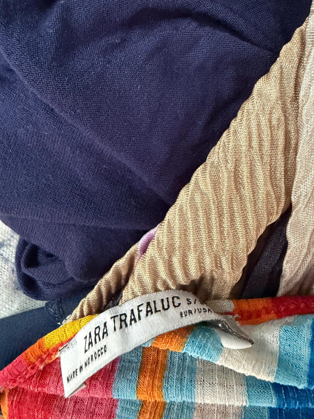 Zara multi-coloured striped sleeveless vest with vibrant Y2K festival style.