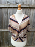 Marks & Spencer multi tunic blouse with textured fabric and wrap twist front design.