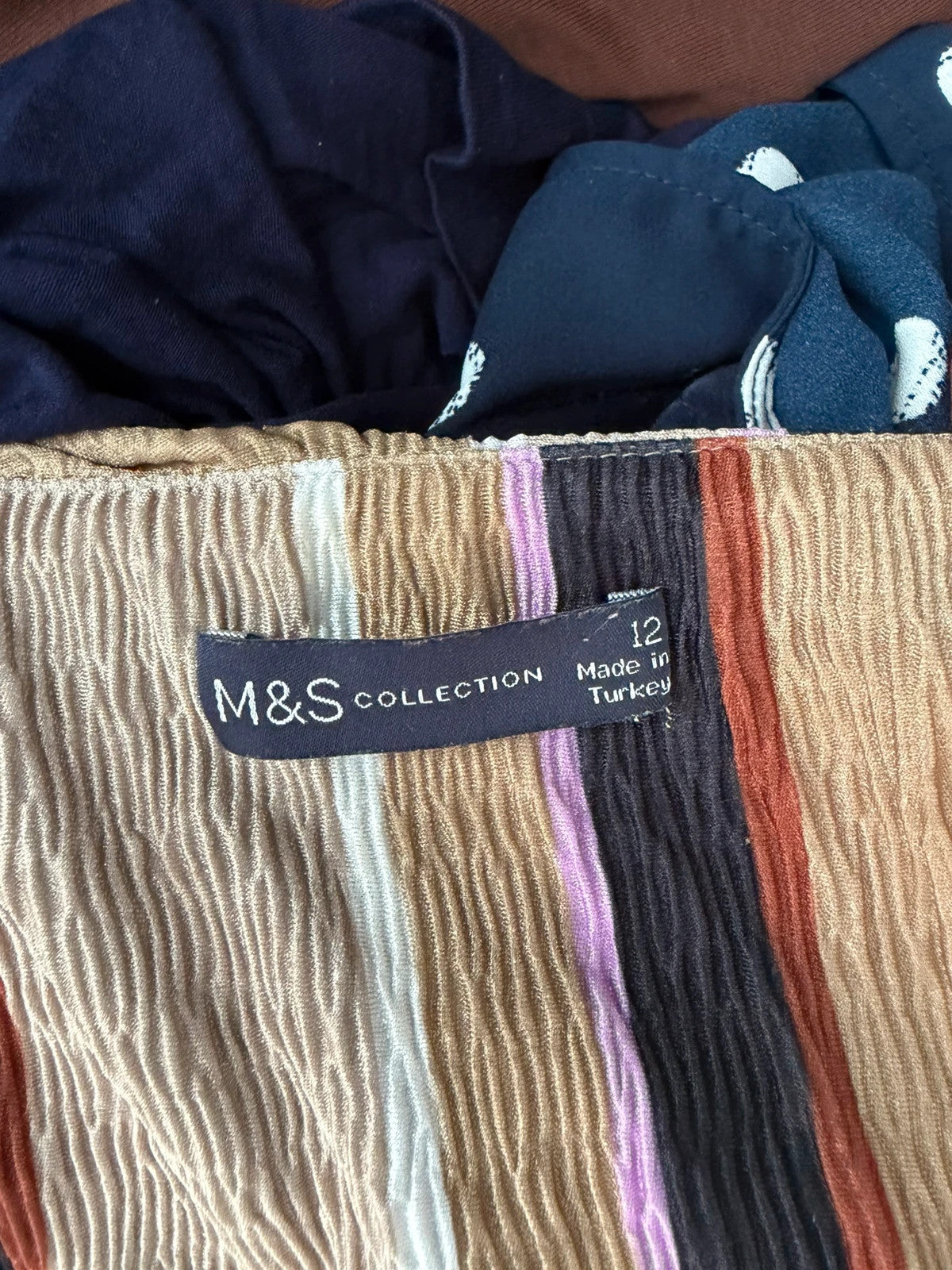 Marks & Spencer multi tunic blouse with textured fabric and wrap twist front design.
