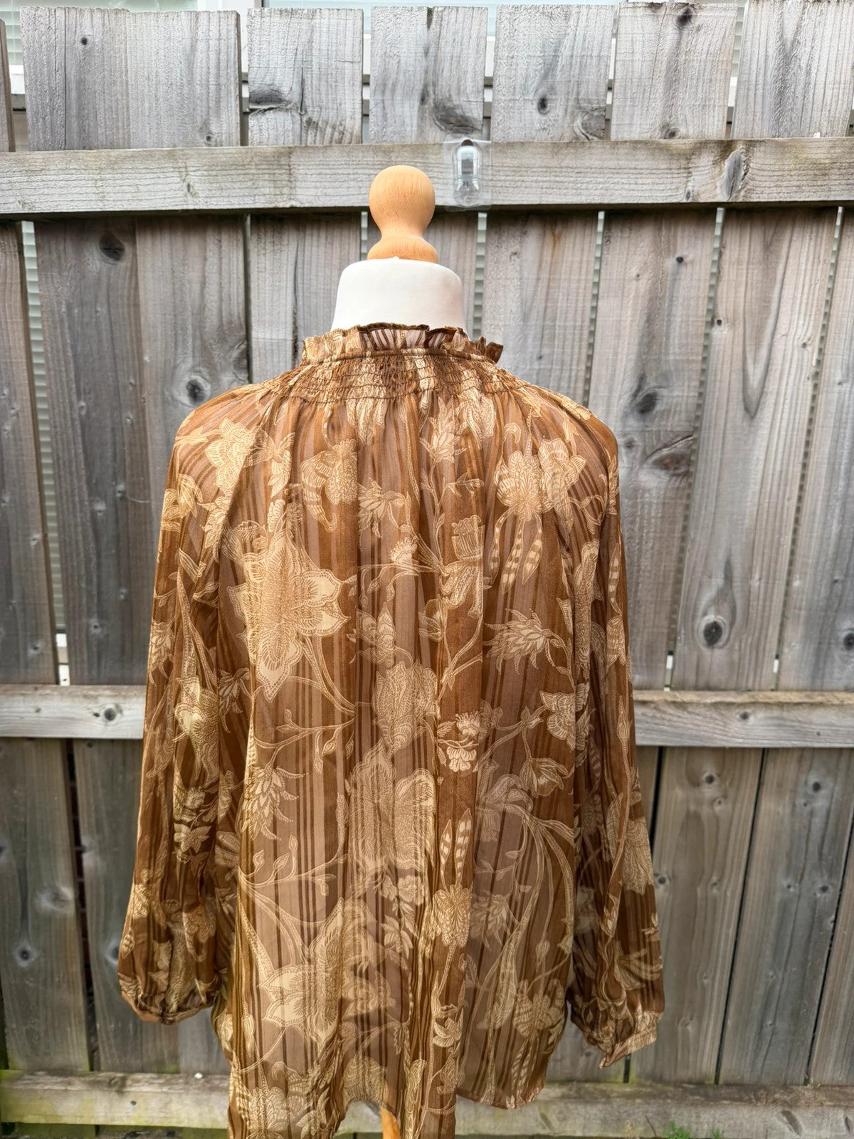 Casuals black and brown floral sheer long sleeve tunic blouses, smart casual style.