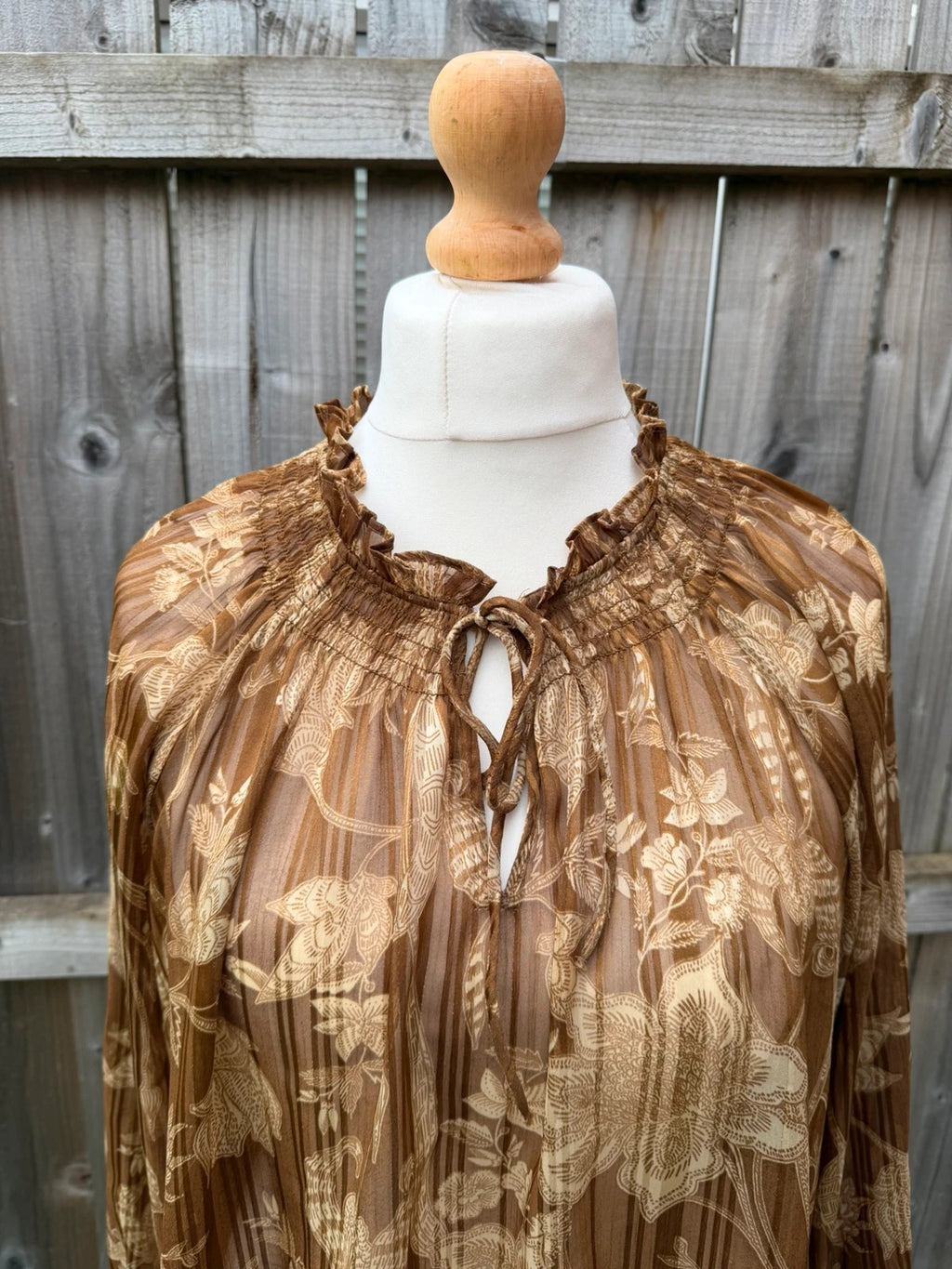 Casuals black and brown floral sheer long sleeve tunic blouses, smart casual style.