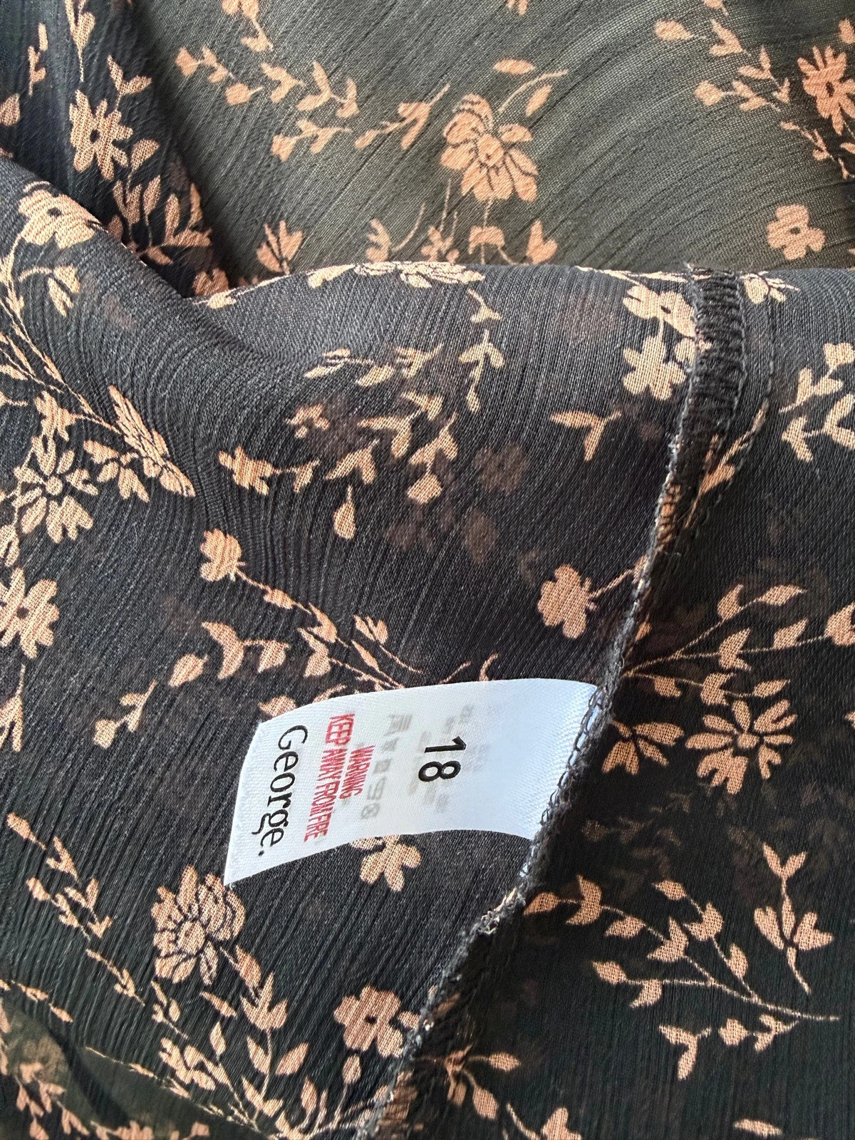 Casuals black and brown floral sheer long sleeve tunic blouses, smart casual style.