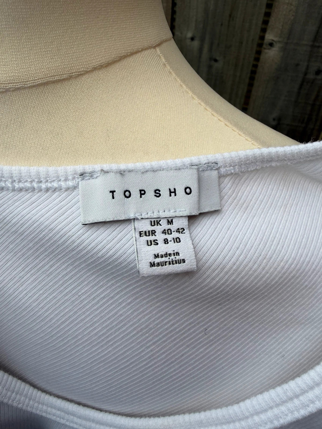 Topshop white pocket t-shirt with ribbed texture and short sleeves.