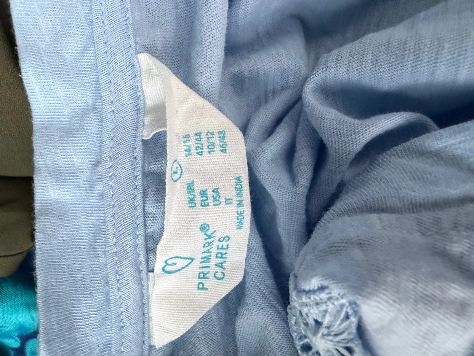 Primark blue pocket t-shirt with relaxed fit and short sleeves, pre-loved condition.