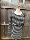 Primark black and white houndstooth midi dress with long sleeves and pockets.