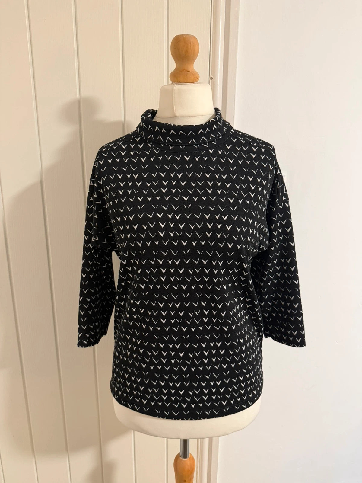 Next black and white striped roll neck top with 3/4 sleeves.