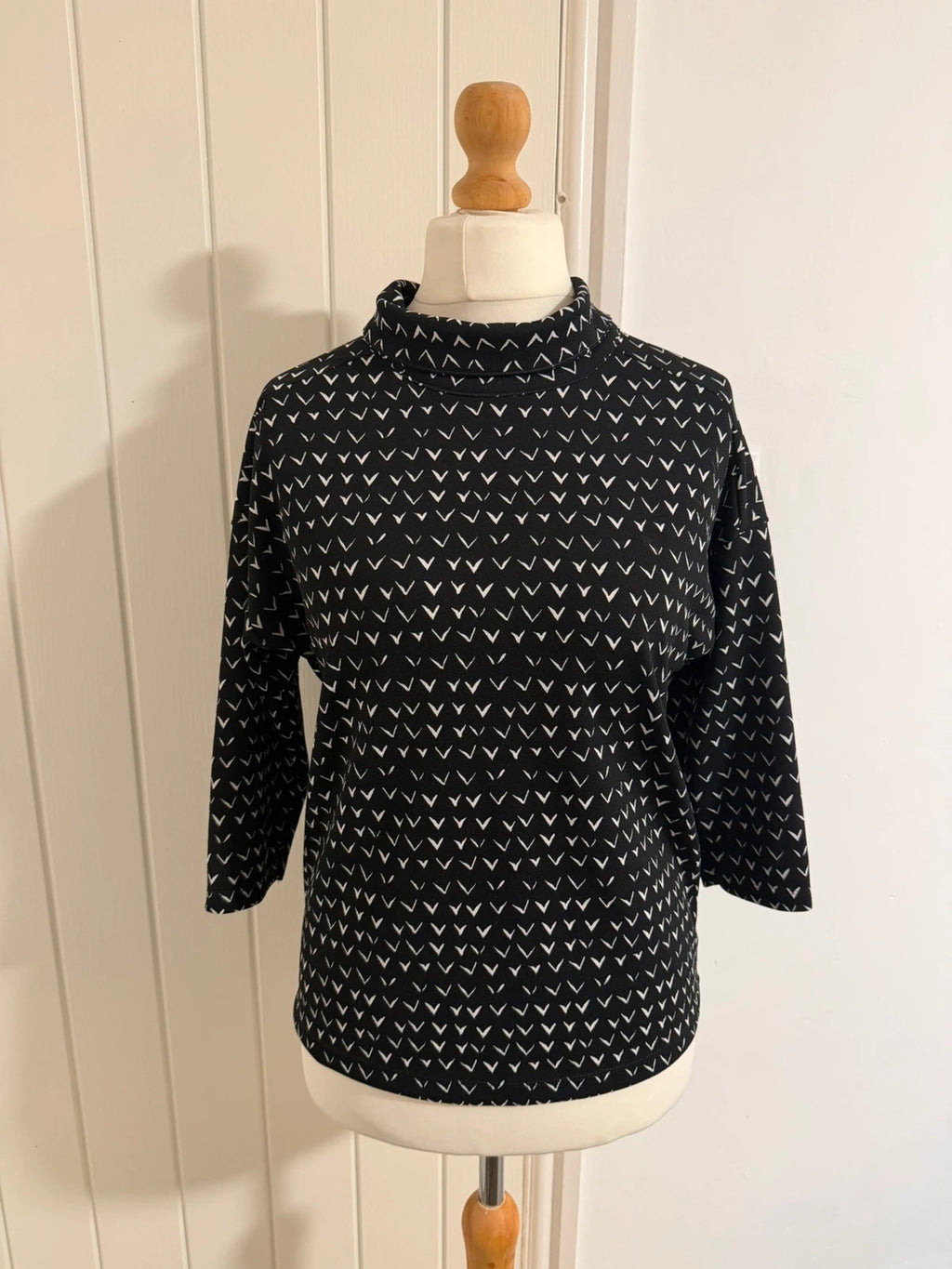 Next black and white striped roll neck top with 3/4 sleeves.
