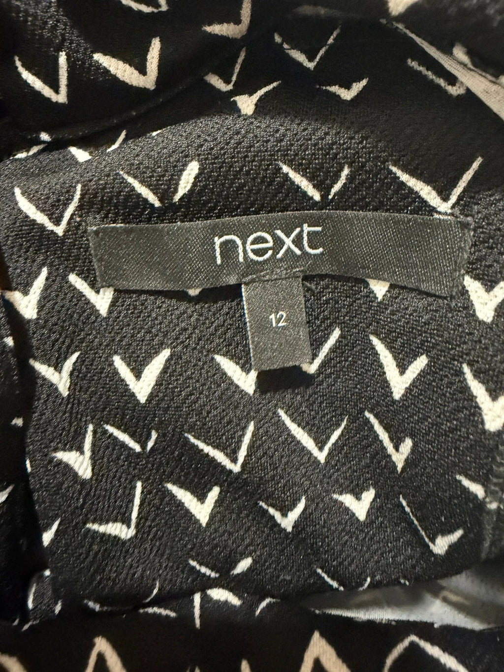 Next black and white striped roll neck top with 3/4 sleeves.