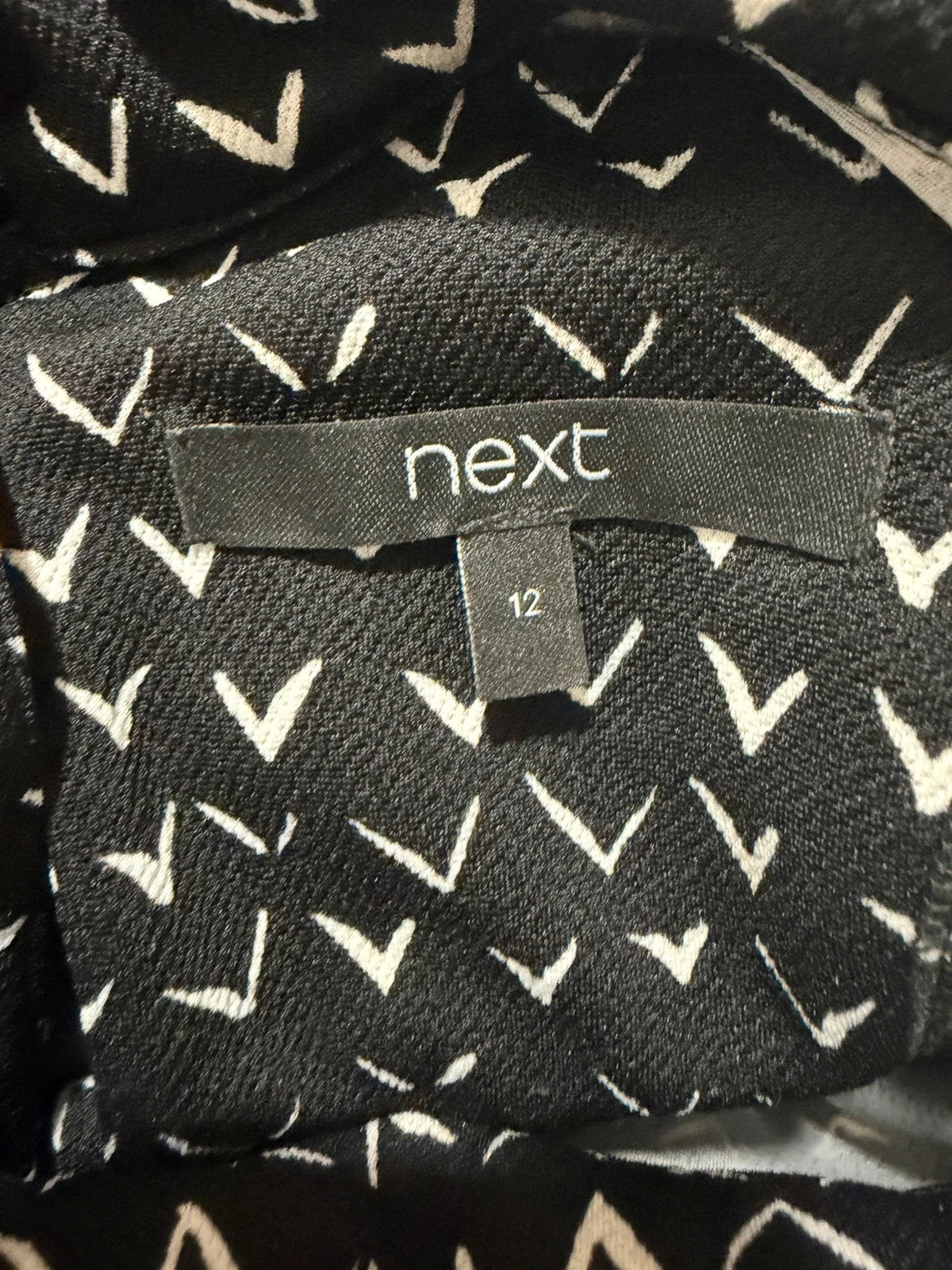 Next black and white striped roll neck top with 3/4 sleeves.