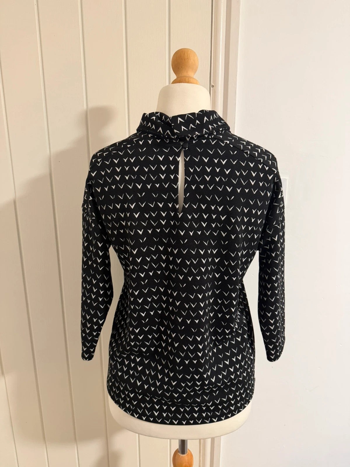 Next black and white striped roll neck top with 3/4 sleeves.