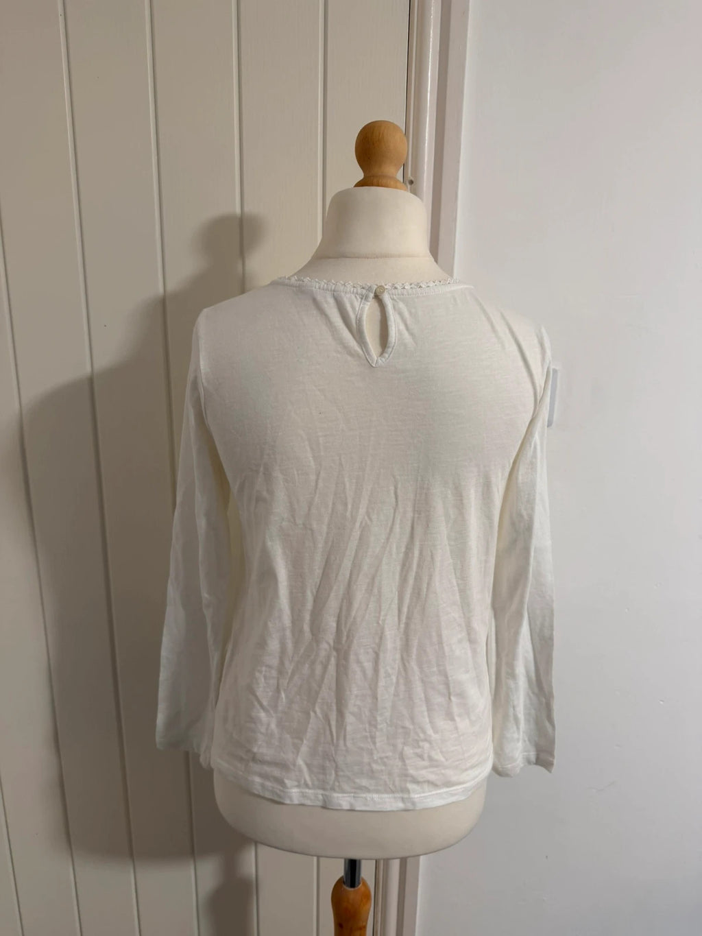 Falmer Heritage white tunic blouse with lace detail and long sleeves.