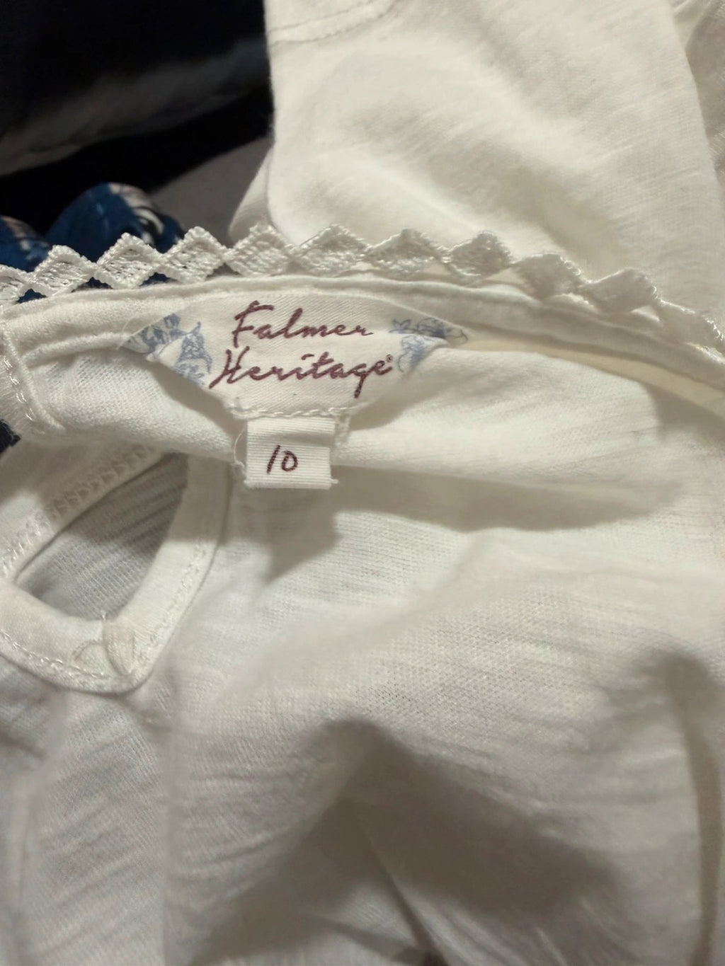 Falmer Heritage white tunic blouse with lace detail and long sleeves.
