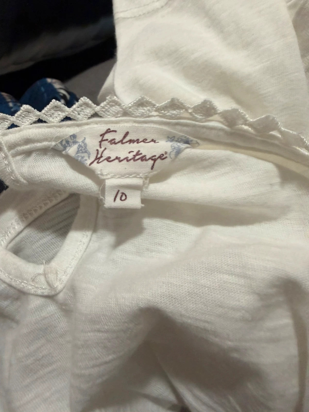 Falmer Heritage white tunic blouse with lace detail and long sleeves.