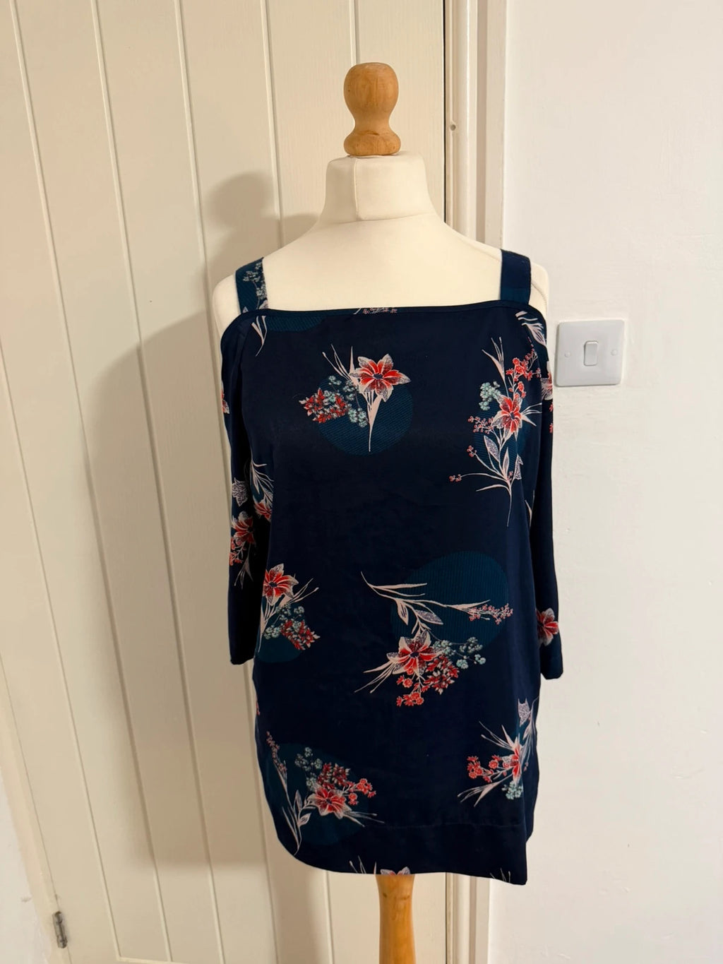 Marks & Spencer navy cold shoulder dress with floral pattern and elegant design.