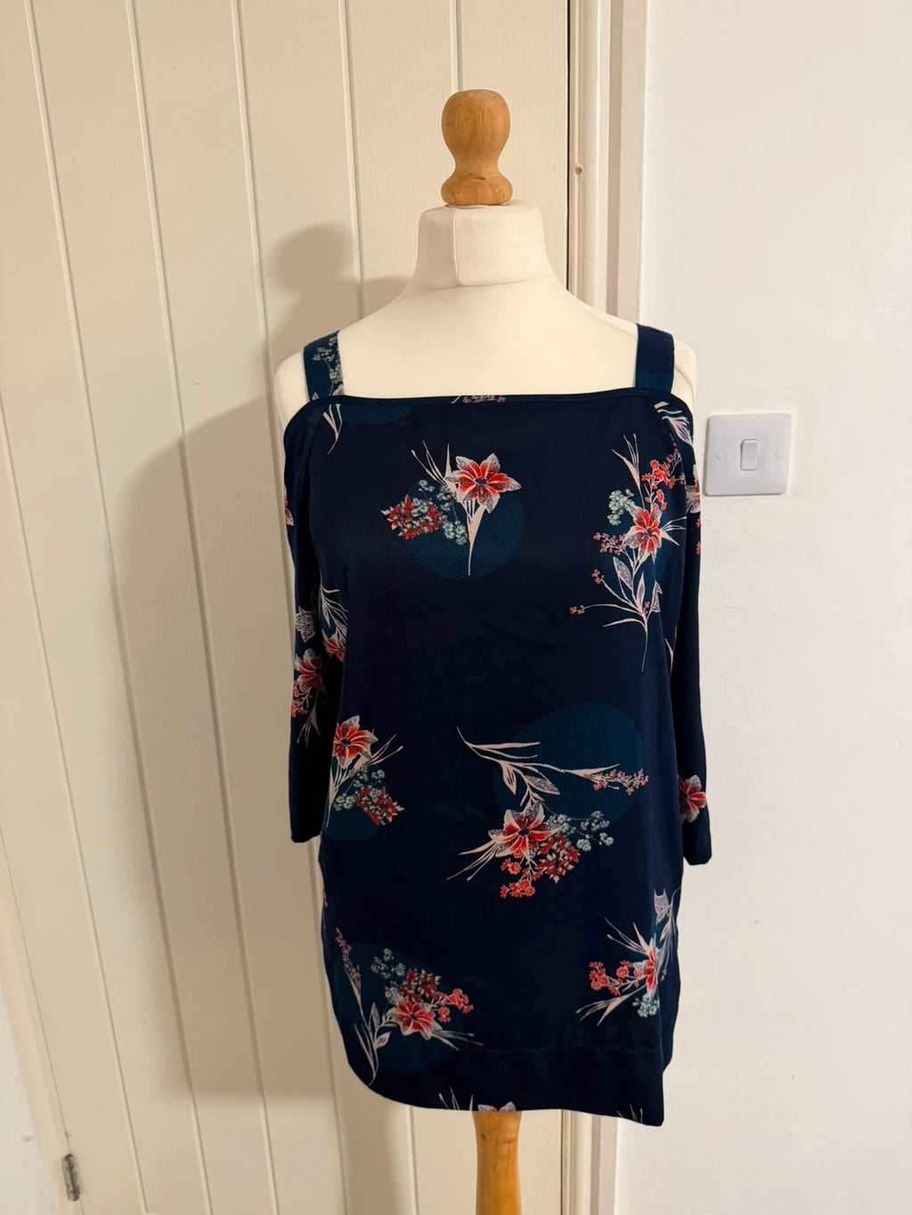 Marks & Spencer navy cold shoulder dress with floral pattern and elegant design.