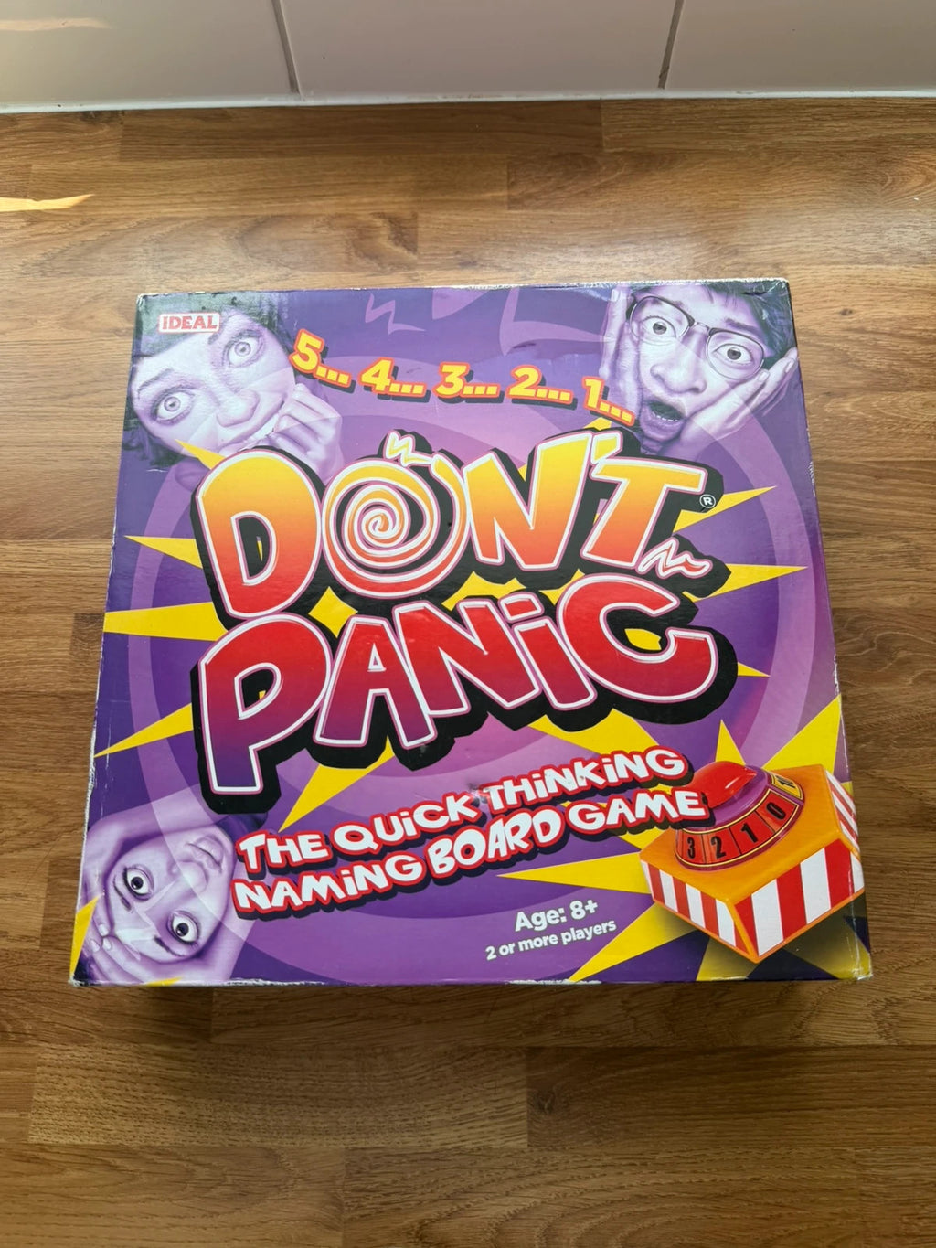 Don't Panic board game blue, cream, green box with playful graphics and complete set.