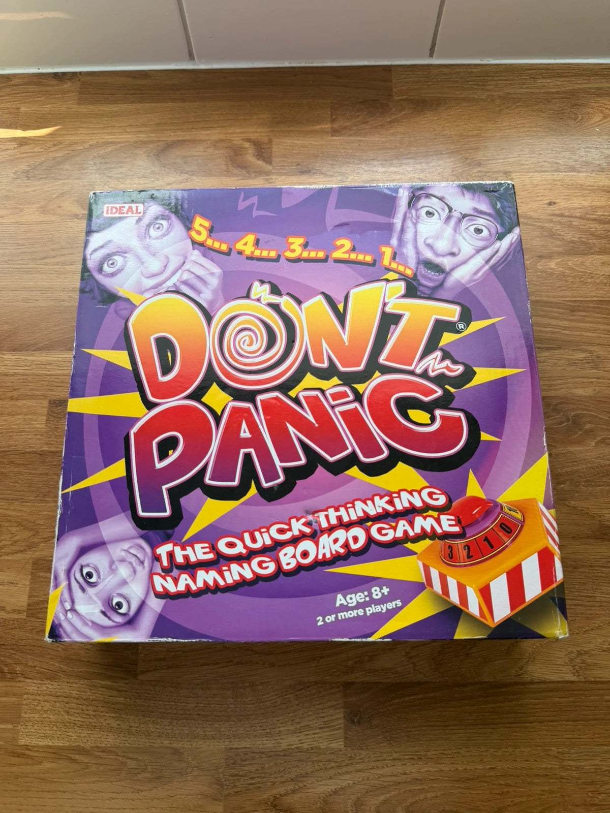 Don't Panic board game blue, cream, green box with playful graphics and complete set.
