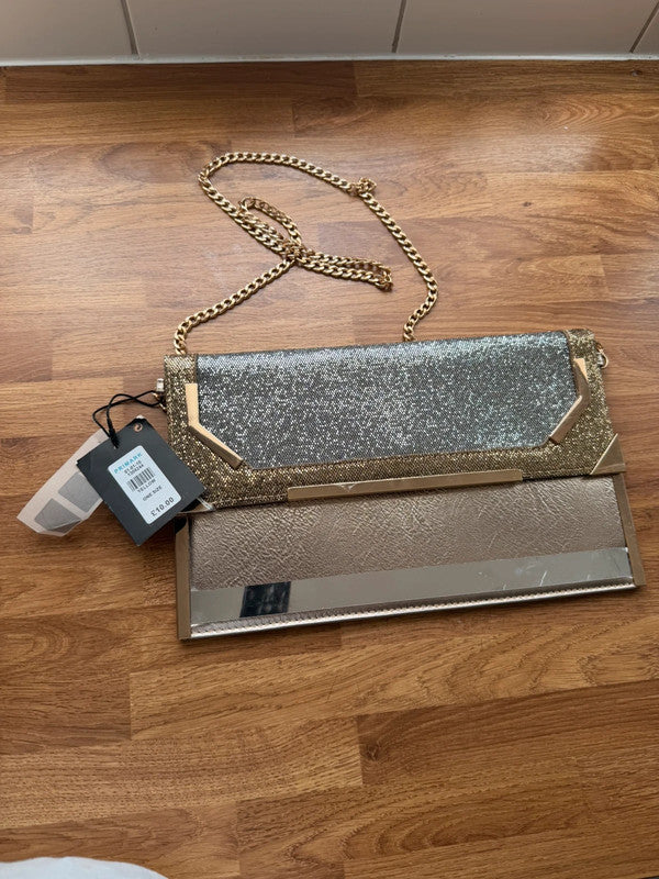 Primark gold clutch bag with glitter finish and new with tags.