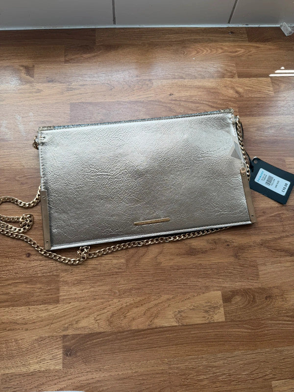 Primark gold clutch bag with glitter finish and new with tags.