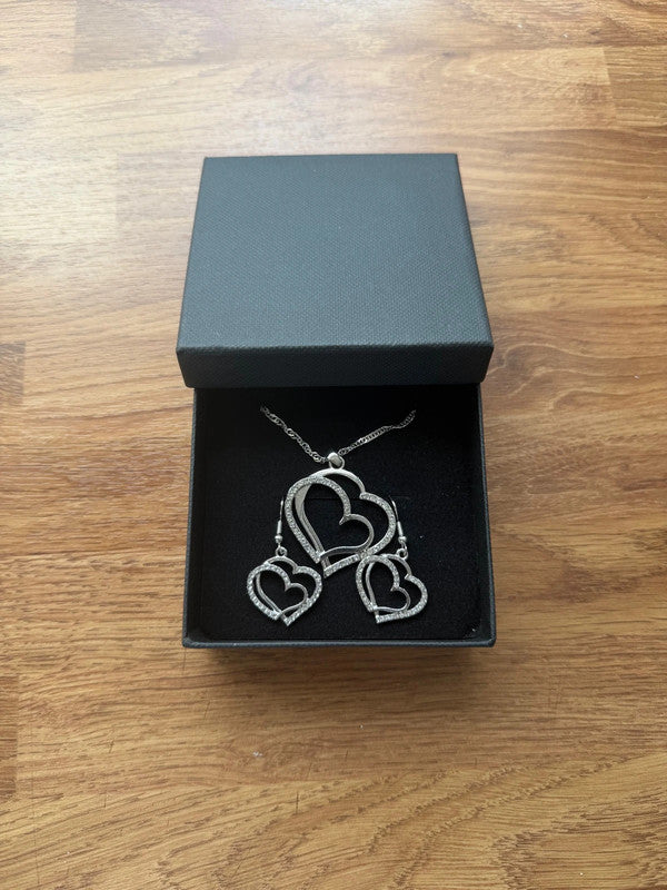 Swarovski silver necklace and earrings set with rhinestone embellishments, elegant design.