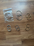 Y2K gold and silver large hoop earrings with shiny finish and statement design.