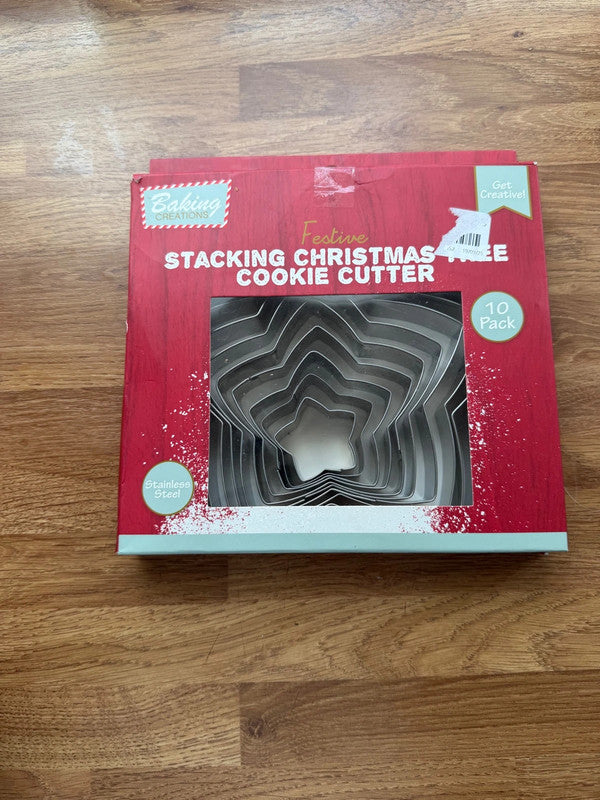 Accessories silver stainless steel cookie cutter set with Christmas tree shapes.