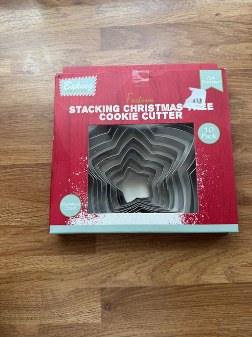 Accessories silver stainless steel cookie cutter set with Christmas tree shapes.