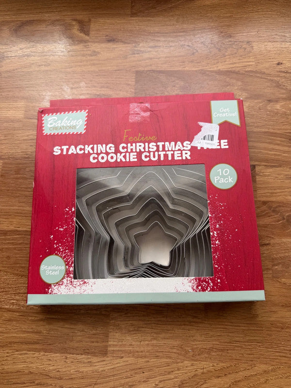Accessories silver stainless steel cookie cutter set with Christmas tree shapes.