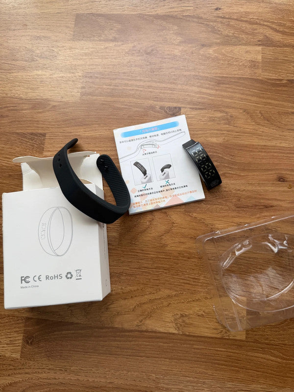 Smart Ring black fitness tracker with Bluetooth, sleep monitor, and charging case.