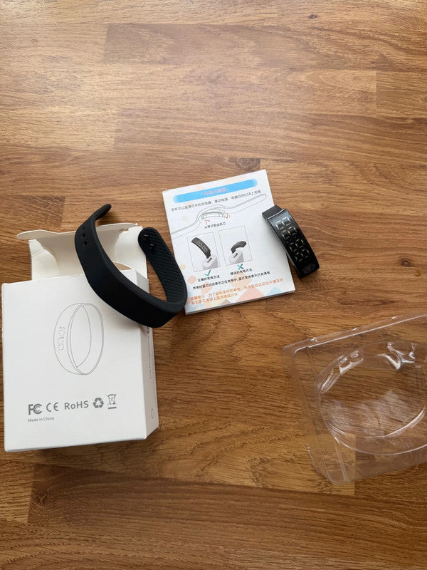 Smart Ring black fitness tracker with Bluetooth, sleep monitor, and charging case.
