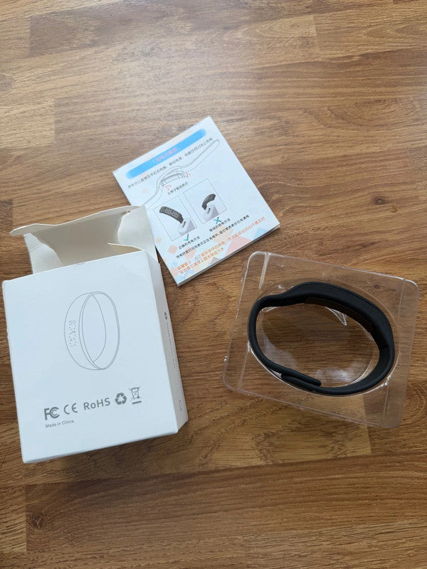 Smart Ring black fitness tracker with Bluetooth, sleep monitor, and charging case.