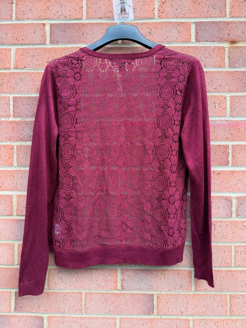 Primark burgundy cardigan with crochet detail and lace back, open front design.