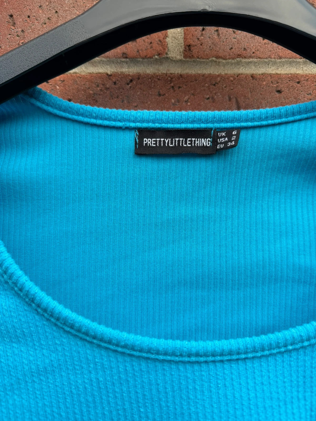 PrettyLittleThing blue cut out crop top, long sleeve bodycon style, size 6.