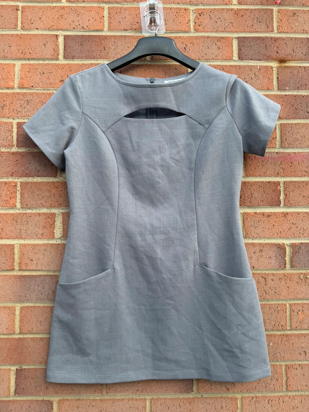 Simon Jersey grey bodycon mini dress with cut-out details, chic office style.