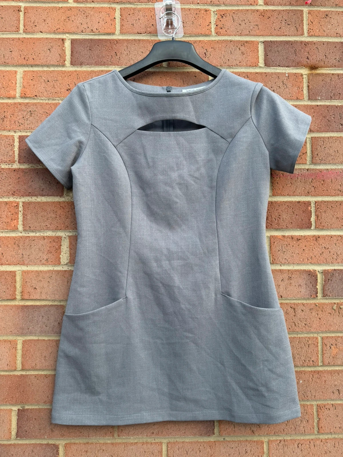 Simon Jersey grey bodycon mini dress with cut-out details, chic office style.