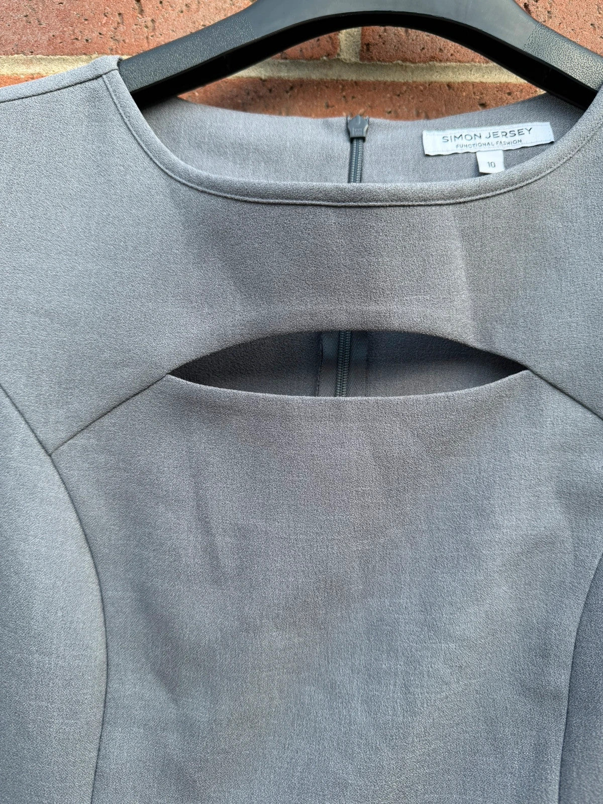 Simon Jersey grey bodycon mini dress with cut-out details, chic office style.