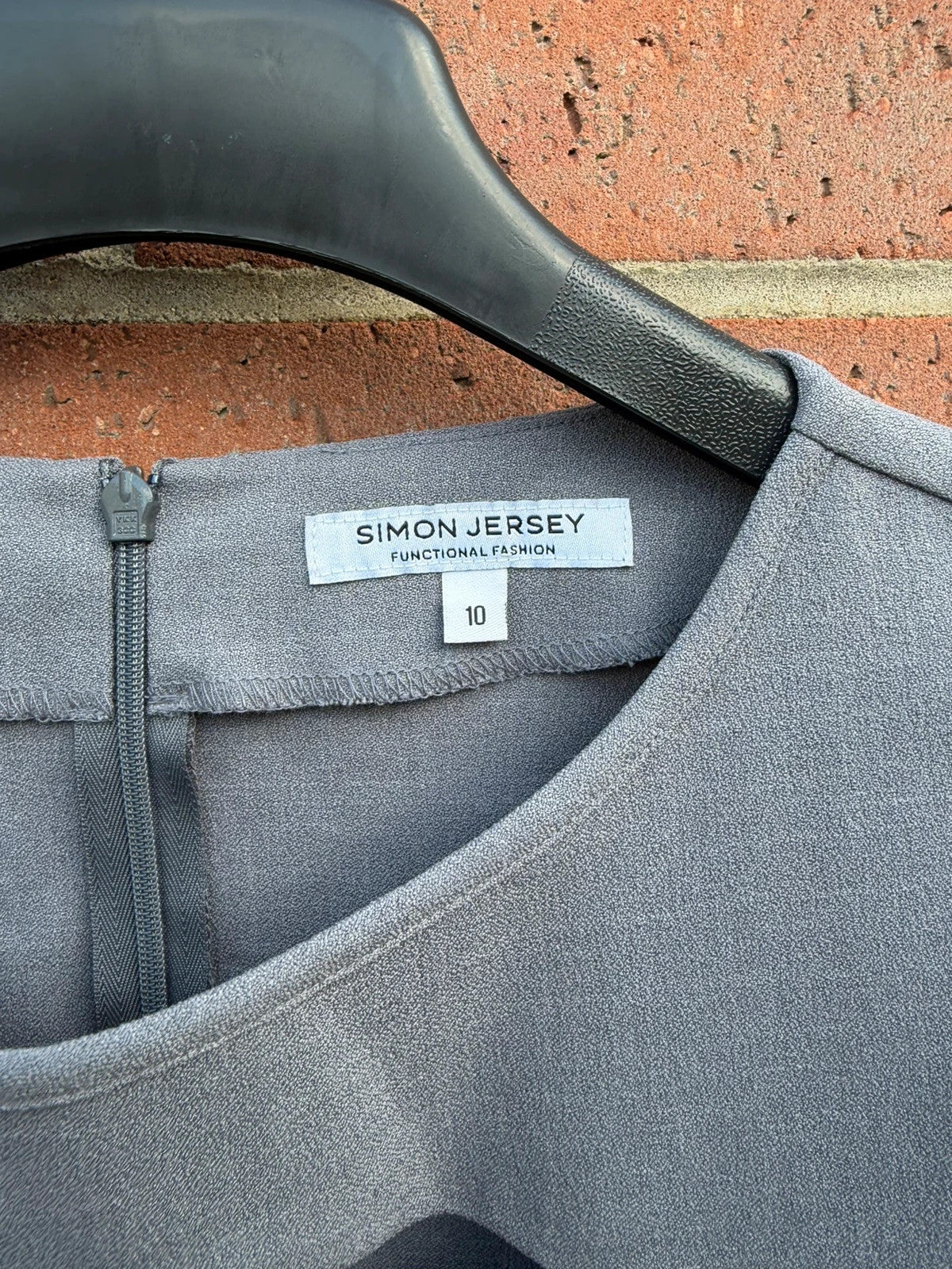 Simon Jersey grey bodycon mini dress with cut-out details, chic office style.